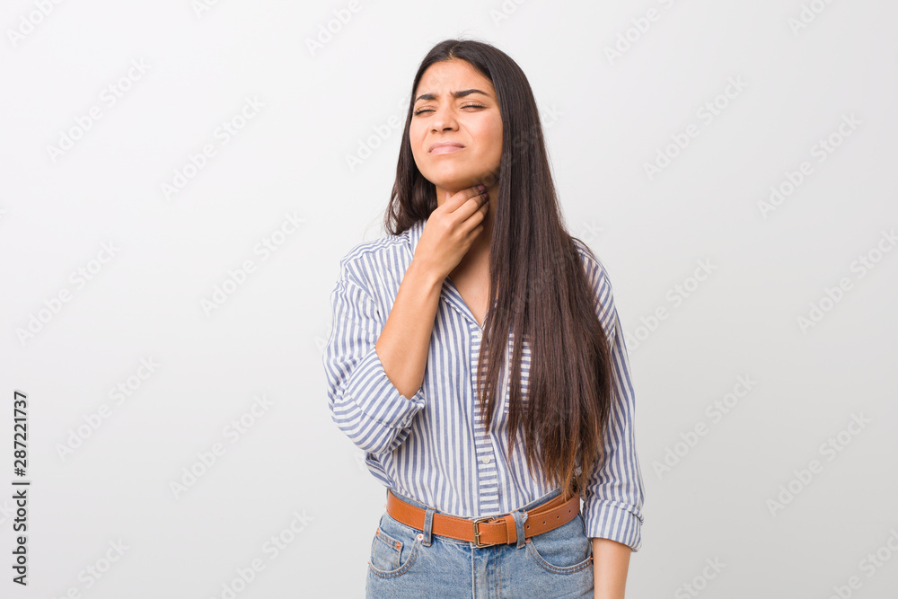 Young pretty arab woman suffers pain in throat due a virus or infection. Young pretty arab woman suffers pain in throat due a virus or infection.