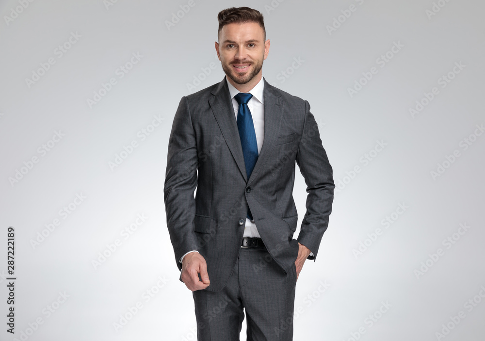 successful young businessman standing with hand in pocket successful young businessman standing with hand in pocket