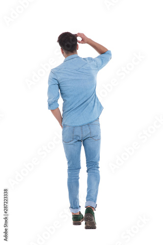 back view of young man wearing denim and thinking © Viorel Sima
