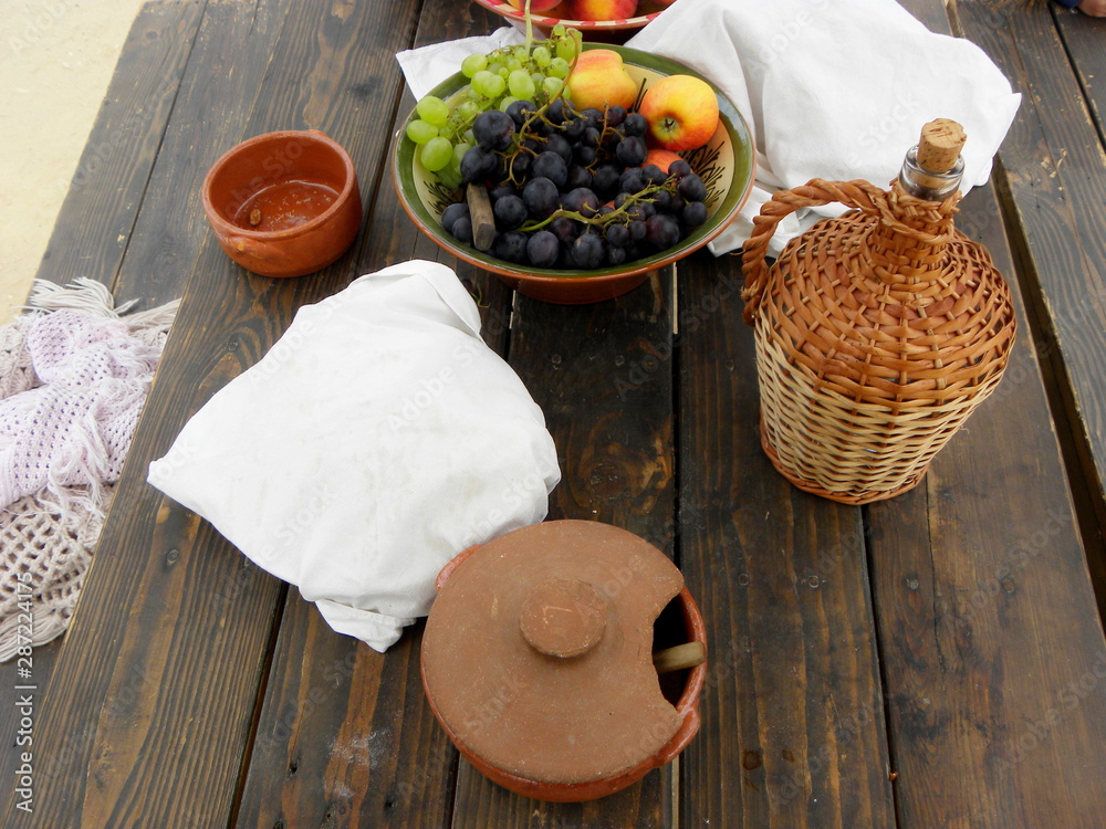 still life with fruit and pottery