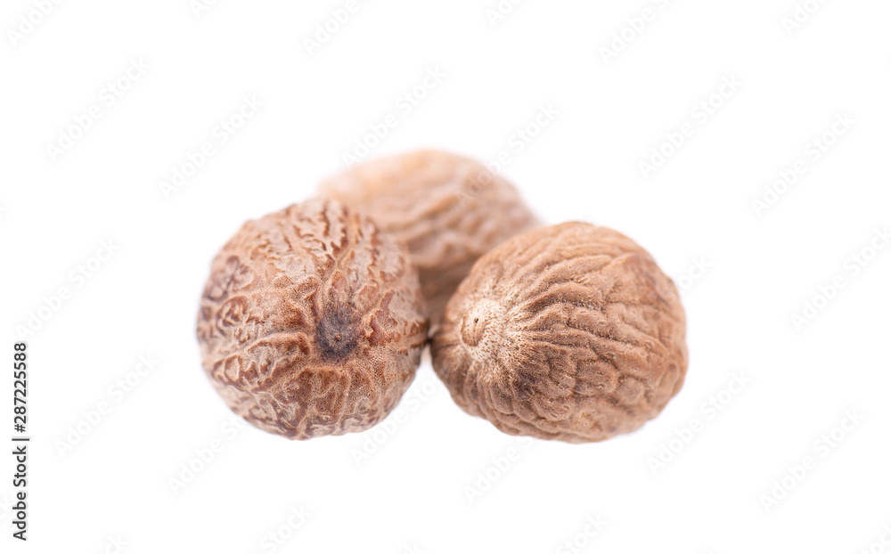 Nutmeg isolated on white background. Two dry whole nutmeg. Clipping path. Nutmeg isolated on white background. Two dry whole nutmeg. Clipping path.