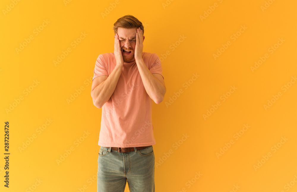 Young redhead man desperate and sad Young redhead man desperate and sad