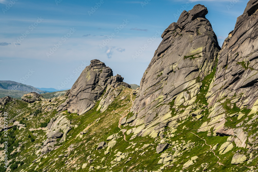 Fototapeta premium Gorgeous view on top of western Sayan mountain range during summer sunny day in Ergaki national park, Siberia, Russia