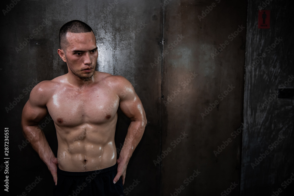 Obraz premium Portrait of asian man big muscle at the gym,Thailand people,Workout for good healthy,Body weight training,Fitness at the gym concept