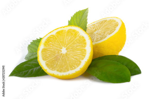 fresh lemons halves with green leaves isolated on white background