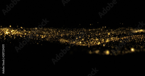 Golden glitter sparkles wave, sparkling particles light flow. Gold glittering sparks flow wave, shimmering light sparks glow on black background