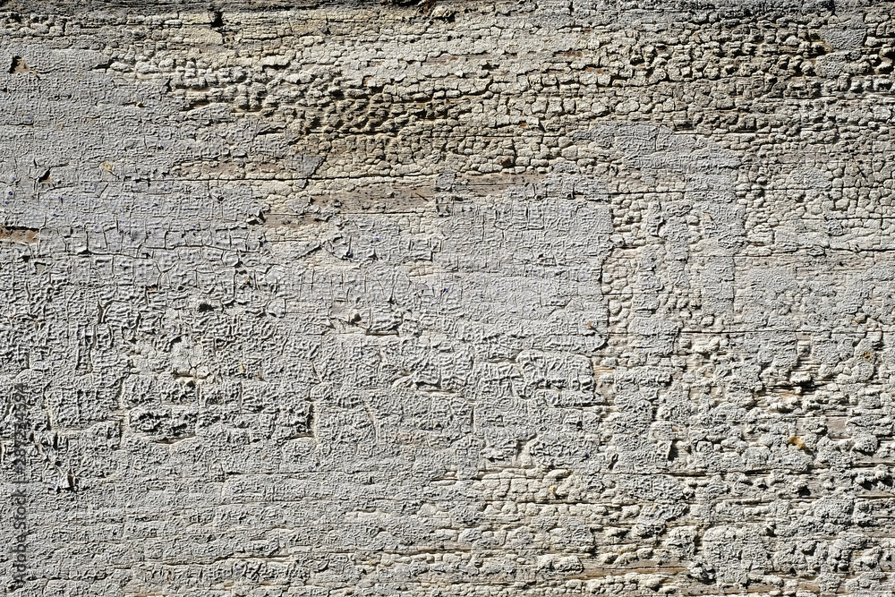 Old peeling paint on a wooden surface. retro wall background. Old peeling paint on a wooden surface. retro wall background.