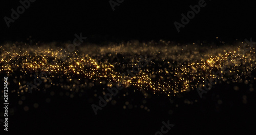 Gold glitter particles, shining gold sparks wave background. Gold glow and shimmering sparkles shine, abstract magic bright sparks in wave motion