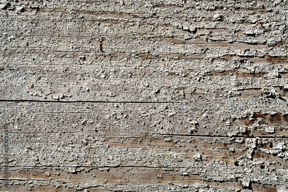 Old peeling paint on a wooden surface. retro wall background. Old peeling paint on a wooden surface. retro wall background.