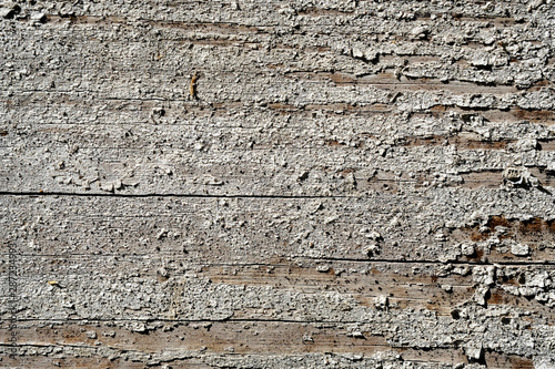 Old peeling paint on a wooden surface. retro wall background.