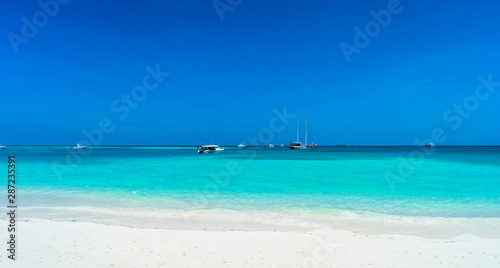 Yacht near the pier of a fabulous island in the Maldives. © lotosfoto