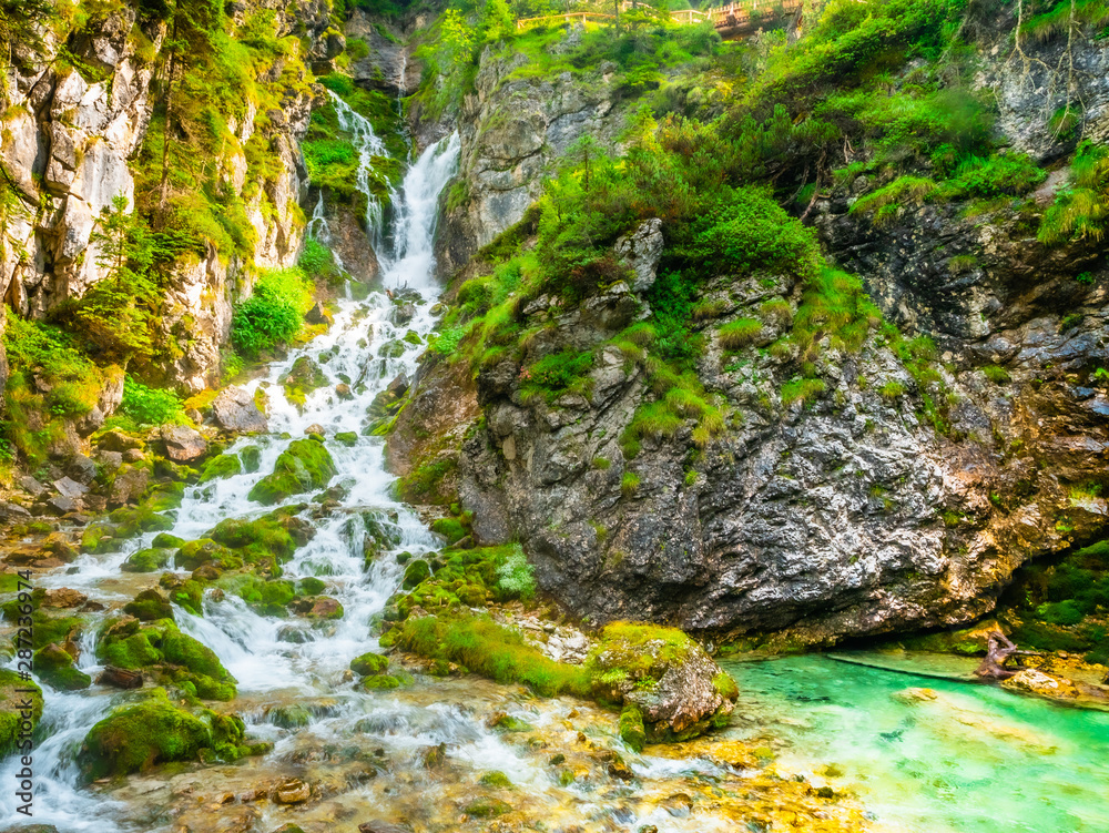 Vallesinella waterfall in the forest of the Italian Trentino national park