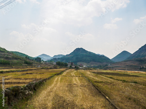 Countryside landscape with agriculture between Luoping and Duoyihe river in Yunnan province China.