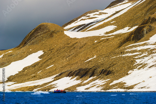 Tourists in inflatable ocean rafts in the Arctic Ocean, Hornsund, Norway. photo