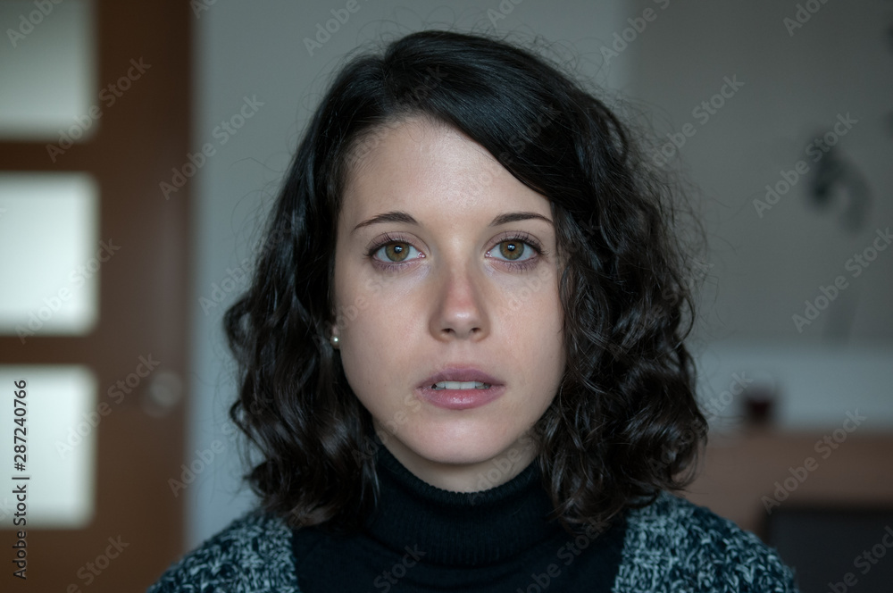Girl with melancholy attitude photographed at home