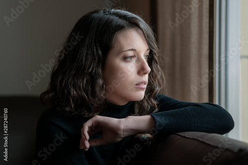 Canvas Print Girl with melancholy attitude photographed at home