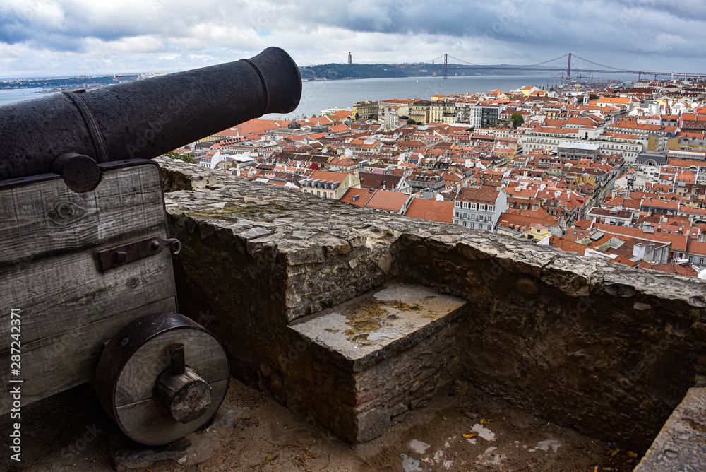 Lisbon, Portugal - July 26, 2019: A Canon overlooks the city of Lisbon at the Castle Sao Jorge