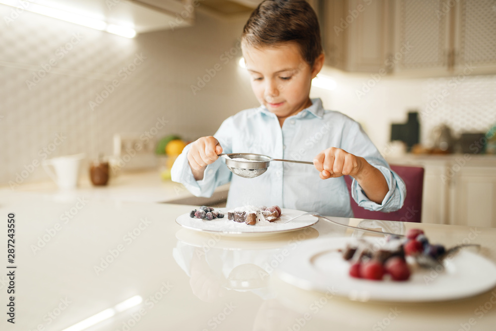 Young boy shows sandwiches with melted chocolate Young boy shows sandwiches with melted chocolate