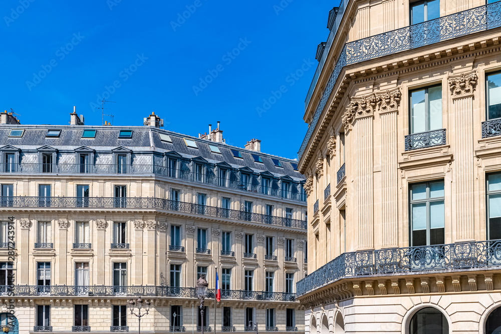 Paris, typical building, parisian facade wall and windows rue Auber