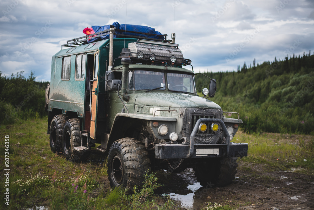 Fototapeta premium expedition car is in the woods