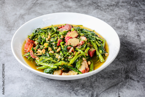 Fried water spinach with barbecued red pork