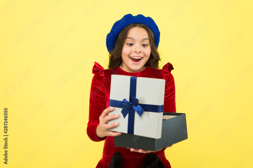 Shopping happiness. surprised small girl with present box. small girl hold holiday gift. happy birthday. boxing day. parisian girl in french beret go shopping. autumn fashion. school fall season Shopping happiness. surprised small girl with present box. small girl hold holiday gift. happy birthday. boxing day. parisian girl in french beret go shopping. autumn fashion. school fall season