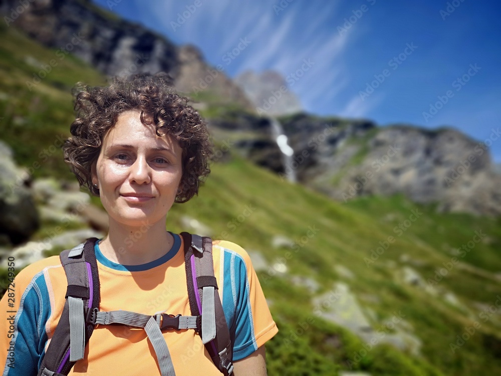 Female hiker portrait in the mountains Female hiker portrait in the mountains