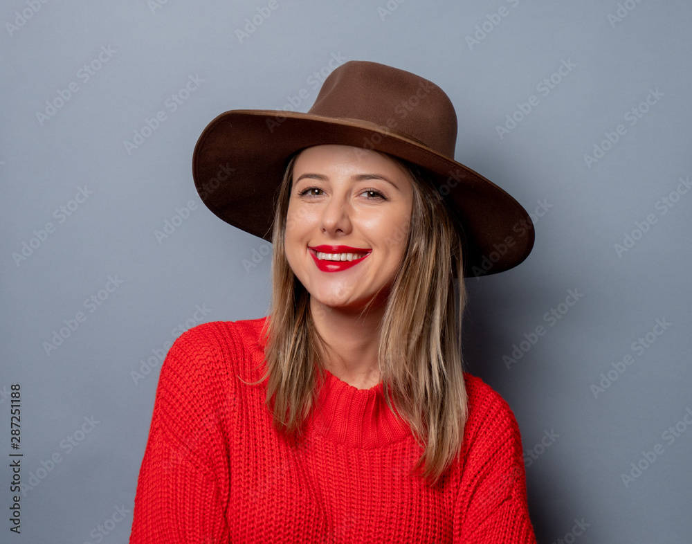 young woman in red sweater and hat young woman in red sweater and hat