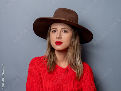  young woman in red sweater and hat