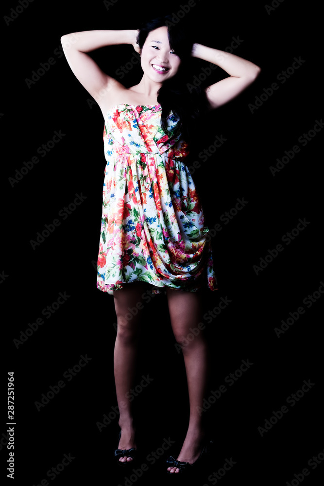Smiling Japanese American Woman Standing In Floral Dress Smiling Japanese American Woman Standing In Floral Dress