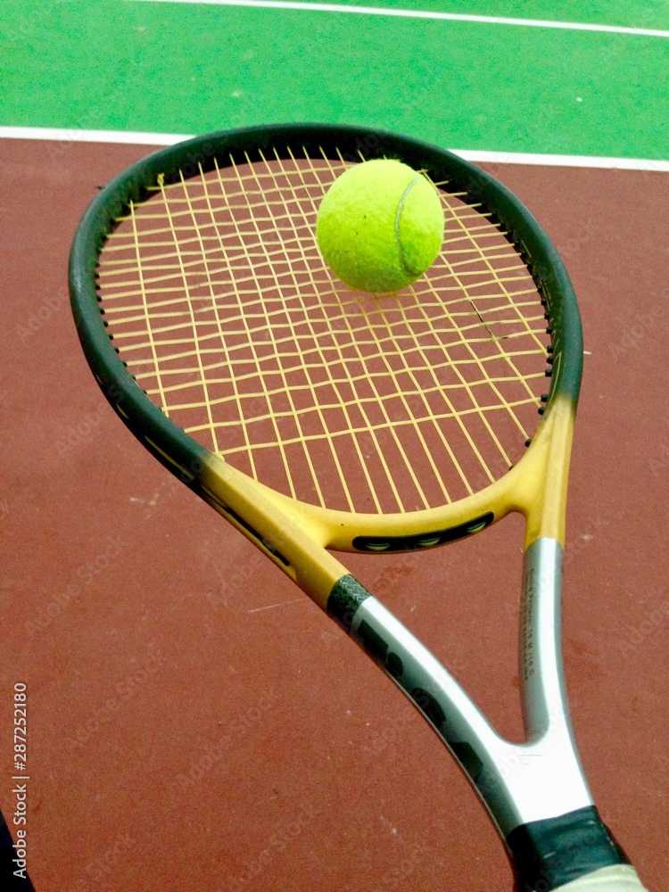tennis racquet and ball for people who are careful with their health 