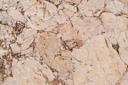 Cracked antique red marble texture and background. Rough natural rock texture.