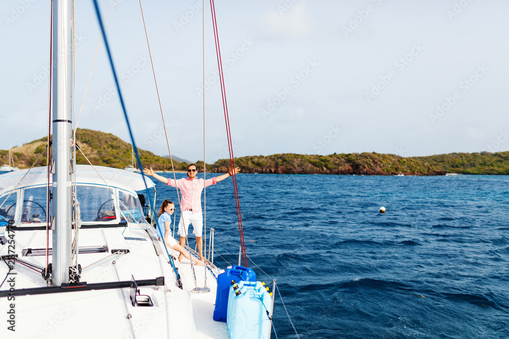 Naklejka premium Family on board of sailing yacht