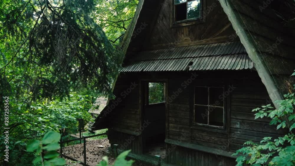 Old wooden abandoned and spooky house in the middle of the forest Old wooden abandoned and spooky house in the middle of the forest