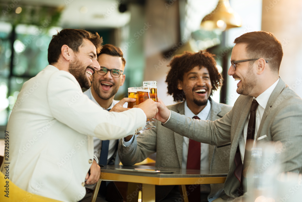 young businessmen after work in a pub