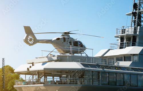 Private luxury ship with helipad. Close-up view.