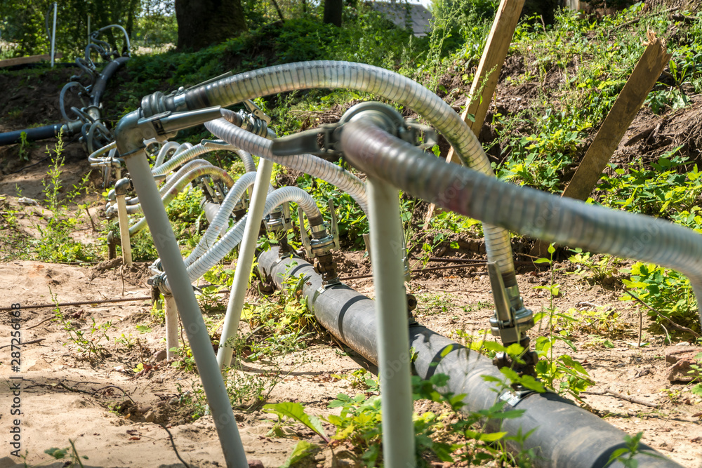 pumping station. groundwater drainage system pumps water out of the ground. dehydration gravel rural route pumping station. groundwater drainage system pumps water out of the ground. dehydration gravel rural route