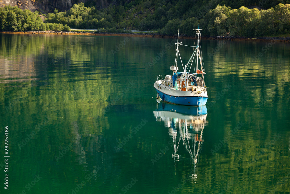 Small beautiful boat in a lake or in a large river Small beautiful boat in a lake or in a large river
