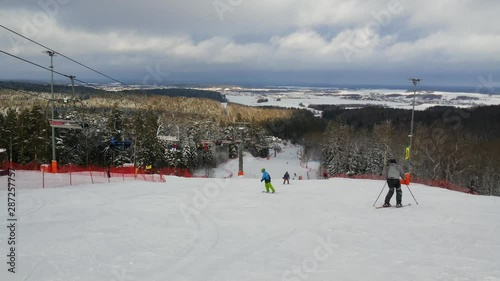 snowboard riding at downhill track photo