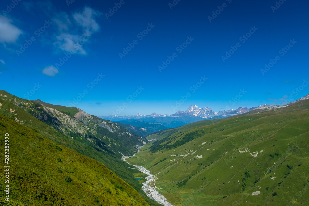 Svaneti landscape with glacier and snow-capped mountain in the back near Mestia village in Svaneti region, Georgia. Svaneti landscape with glacier and snow-capped mountain in the back near Mestia village in Svaneti region, Georgia.