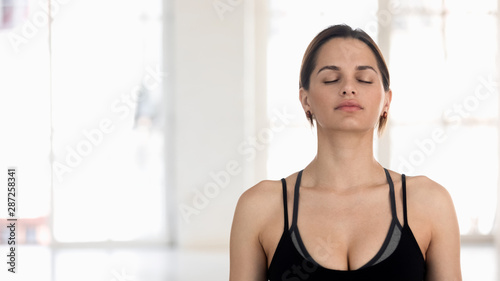 Free Download Beautiful woman with closed eyes practicing yoga, relaxing, meditating - GFXLoad