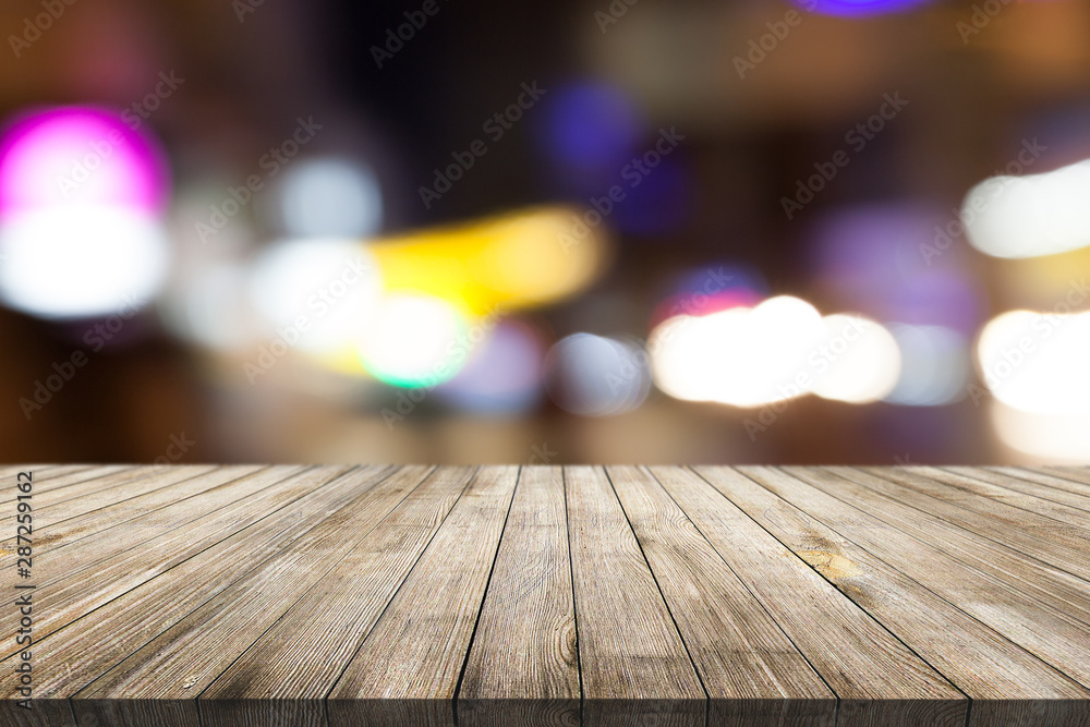 Wooden desk on bokeh blur abstract natural background