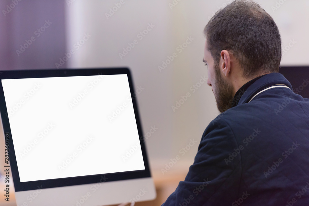 Young male Businessman working on modern computer. Businessman using innovative technologies. Businessman working on computer, software developing with modern tech on virtual screen. Young male Businessman working on modern computer. Businessman using innovative technologies. Businessman working on computer, software developing with modern tech on virtual screen.