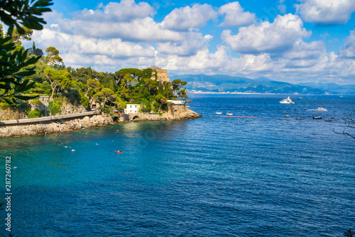 Paraji, Liguria, Italy - August 15, 2019: Bay in the Liguria Regina / Beautiful sea bay with fashionable yachts and boats / Houses on a cliff / Popular resort in Europe