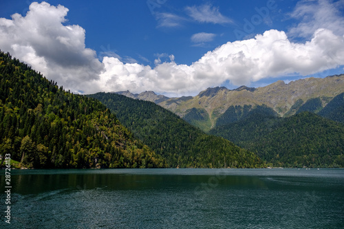 Ritsa Lake surrounded by mountains in sunny day
