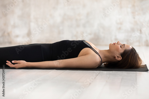 Woman practicing yoga, Savasana, Dead Body pose, Corpse close up