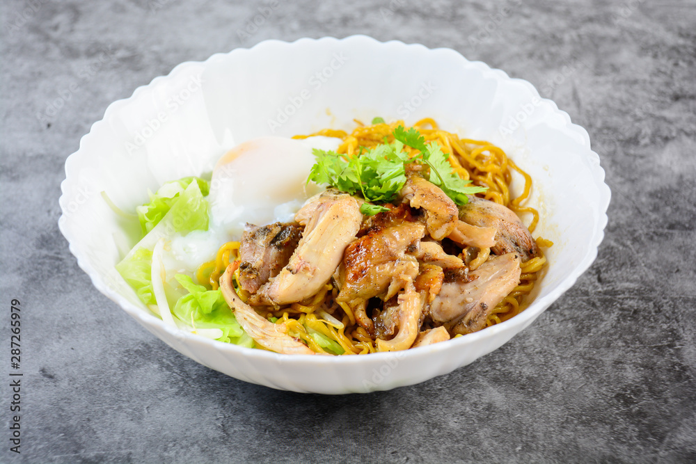Egg noodles served dry with roasted honey chicken and soft-boiled eggs (onsen tamago eggs) Egg noodles served dry with roasted honey chicken and soft-boiled eggs (onsen tamago eggs)
