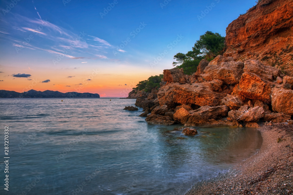 Beautiful view of rocky beach during sunset.