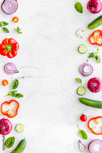 Cook frame with fresh vegetables on marble background top view space for text