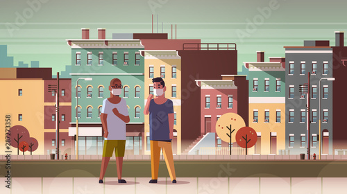 men wearing face masks toxic gas air pollution industry smog polluted environment concept mix race guys walking outdoor dirty smoke city buildings cityscape background full length horizontal